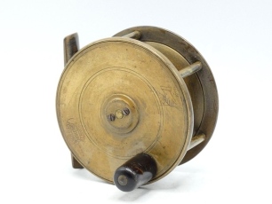 A Hardy Birmingham 3 &frac14;" brass wide drummed light salmon fly reel, tapered horn handle, block foot, quadruple cage pillars, fixed check mechanism, faceplate with raised two screw spindle boss and stamped Rod in Hand trade mark and enclosed oval logo, light