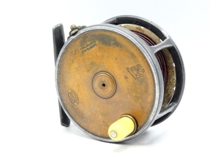 A Hardy Brass Faced Perfect 4 &frac14;" salmon fly reel, domed ivorine handle, pierced alloy block foot, quadruple waisted drum pillars, strapped rim tension screw with Turk's head locking nut and early calliper spring check mechanism, slightly dished drum with