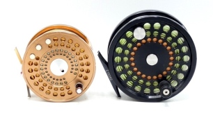 A Marryat MR9 sea-trout/light salmon fly reel and spare spool, bronze anodised finish, multi-perforated drum with counter-balanced handle and spring release latch, block foot, rear off-set tension adjuster, only very light signs of use, in card boxes and 