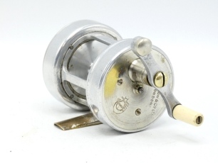 A very rare Farlow Billiken multiplying bait casting reel, alloy construction with 3:1 ratio gearing, off-set tapered ivorine handle on counter-balanced arm which disengages the spool for casting when raised and turned, removeable alloy rear plate with s