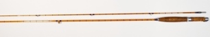 A scarce Hardy "C.C. de France" 2 piece cane brook trout fly rod, 6'6", crimson silk inter-whipped, sliding alloy reel fitting, agate lined butt and tip rings, suction ferrule, handle discoloured from normal use otherwise good overall condition, 1961, in