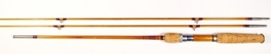 A scarce F.E. Thomas "EF 551" 2 piece (2 tips) cane bass/bait casting rod, 5'6", dark tan silk wraps, staggered ferrule, wooden reel seat, alloy down locking screw grip reel fitting, suction joint, only very light signs of use, in bag and original brass 