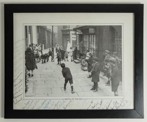 &lsquo;Match of the Day&rsquo;. Large mono printed reproduction of a 1930s street scene photograph depicting boys playing cricket, printed title to lower border. Signed in ink to the borders by 37 international Test cricketers. Signatures include Richie Benaud, Brian