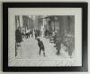 &lsquo;Match of the Day&rsquo;. Large mono printed reproduction of a 1930s street scene photograph depicting boys playing cricket, printed title to lower border. Signed in ink to the borders by 37 international Test cricketers. Signatures include Richie Benaud, Brian