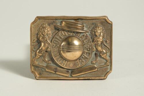 &lsquo;Honi soit qui mal y pense&rsquo; translates roughly to &lsquo;Shame on him who thinks evil of it&rsquo;. Brass cricket belt buckle of oblong form with large cricket ball to centre with the legend in circle around it, two lions to sides, boater to top and two bats below. 2