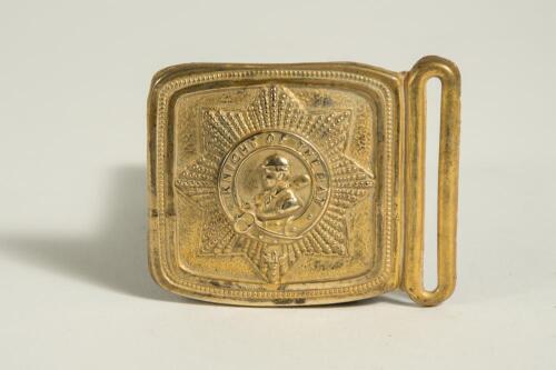 &lsquo;Knight of the Bat&rsquo;. Brass cricket belt buckle of almost square form with head and shoulders image of a batsmen to centre with the legend in circle around it within a octagram shape star, beaded border. Approximately 2.5&rdquo;x2&rdquo;. Good condition