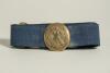 &lsquo;England&rsquo;s Delight&rsquo;. Early and complete material belt with oval shaped brass belt buckle showing crossed bats inter twinned in an oval circle with crown to top and horizontal cricket stumps with legend to oval circle. The buckle measures approximately 1.7