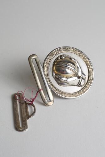 &lsquo;Caught&rsquo;. &lsquo; Early and exquisite Victorian silver and brass circular belt buckle, with clasp to back and hook, depicting a pair of hands holding a cricket ball as if just caught circa 1860/70&rsquo;s. Decorative gilt patterned borders. Approximately 2.75&rdquo;x2&rdquo;. Di