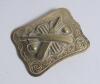 Belt buckle. Early and exquisite Victorian embossed oblong brass belt buckle, with clasp and flat hook to back, decorated to centre with crossed bats, stumps and two balls circa 1860/70&rsquo;s Decorative swirling borders. Approximately 2.5&rdquo;x2&rdquo;. Very good/excel