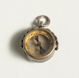 Cricketers&rsquo; compass. Small ornate Victorian silver hallmarked circular compass with compass to face and to verso image of batsman with stumps and wicket keeper behind. Metal loop suspension. Decorative casing. Unusual. Approximately .75&rdquo; diameter. Minor w
