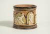 Doulton Lambeth stoneware tobacco jar, hand decorated with six moulded relief vignettes of cricketers to each arched roundel, three in various batting poses, one in wicket-keeping pose and two in fielding pose with an impressed overall flower motif on the - 3