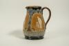 Doulton Lambeth stoneware jug, of bulbous form, moulded with relief vignettes of cricketers, a batsman, bowler and wicket keeper, Abel, Woods and McGregor in white on a brown background. With stylised floral leaf and flower Art Nouveau decoration to top a - 2