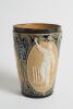 Doulton Lambeth stoneware beaker, moulded with relief vignettes of cricketers, a batsman, bowler and wicket keeper, Abel, Woods and McGregor in white on a brown background. With stylised daisy and floral leaf Art Nouveau decoration to top and sides in gre - 2