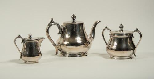 Maurice William Tate. Sussex & England 1912-1937. E.P.B.M. silver plated tea set, comprising of a teapot, sugar bowl and milk jug. Engraved to the teapot is the following inscription &lsquo;Johnnie Walker Trophy. Presented to M.W. Tate, Adelaide 1925&rsquo;. The suga