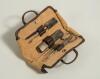 Leather cricket bag manicure set. An exquisite miniature real leather cricket bag with stud connector which opens up to reveal a full and complete five piece manicure set including nail buffer, pair of nail scissors, file etc. Each with strapping to hold 