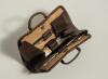 Leather cricket bag manicure set. An exquisite miniature real leather cricket bag with stud connector which opens up to reveal a full and complete five piece manicure set including nail buffer, pair of nail scissors, file etc. Each with strapping to hold - 2