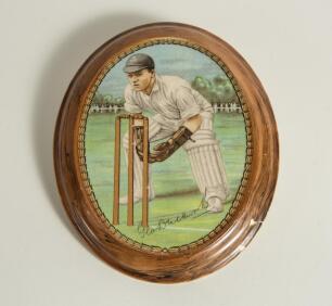 George Duckworth. Lancashire & England. New Hall pottery oval wall plaque printed with a portrait of Duckworth keeping wicket, with a facsimile signature and brown rim. 6.5&rdquo;. Circa 1930. &lsquo;N.H.P.&rsquo; stamp to verso, fading. Repaired damage to plaque outer edg