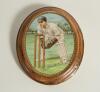 George Duckworth. Lancashire & England. New Hall pottery oval wall plaque printed with a portrait of Duckworth keeping wicket, with a facsimile signature and brown rim. 6.5&rdquo;. Circa 1930. &lsquo;N.H.P.&rsquo; stamp to verso, fading. Repaired damage to plaque outer edg