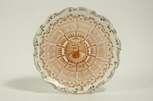 William Gilbert Grace. Original Coalport porcelain plate commemorating W.G. Grace&rsquo;s Century Of Centuries 1895, decorated in the rarer puce (redish brown) with central portrait of Grace and dates of each individual century and who scored against radiating 