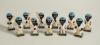 Robertson golliwog cricketers. Eleven different figures wearing cricket attire and blue caps, including eight batsmen in varying poses, one bowler and two wicket- keepers. Each approx. 2.5&rdquo; tall with &lsquo;Robertson&rsquo; to base. Date unknown. Minor wear, odd chip