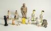 Cricket ceramics and metalware. Varied selection of items including modern metal figures of cricketers, a pair of cricket wicket bookends, a boy cricketer made out of slate, two cricket duck batsman by Acorn Ceramics, a bulldog batsman, a golliwog egg cup