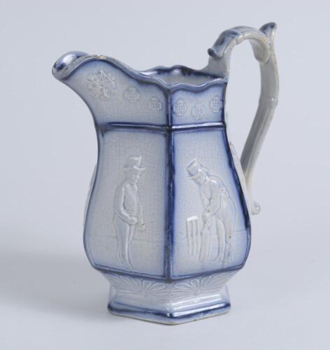 Cricket jug. A light blue mid 19th century Staffordshire salt-glaze jug, the hexagonal bulbous body divided into six panels with cricketers wearing top hats, being Pilch, Clarke and Box. The panels nicely highlighted in a darker cobalt blue. Above and bel