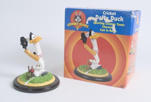 A &lsquo;Cricket Daffy Duck&rsquo; batsman cricketer. Sporting Looney Tunes character cast in resin. Warner Bros 1999. Daffy is shown cork screwing in his shot, the ball breaking the wicket. In original box. Good condition