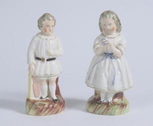 Staffordshire cricket figures. Pair of original decorative Staffordshire 19th century pottery figures depicting a boy holding a cricket bat, wearing a white smock coat with belt, and a girl, in three quarter length dress, holding a ball. Approximately 6&rdquo; 