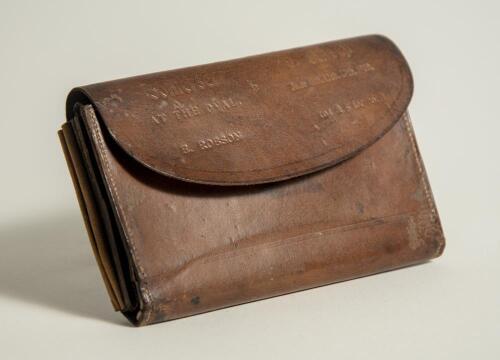 Ernest Robson. Somerset 1895-1923. &lsquo;Surrey v Somerset. The Oval 1900&rsquo;. Brown leather wallet with compartments for cash, coinage, documents, paper book for notes with bone? pen etc. Inscribed to the closing flap of the wallet Somerset v Surrey at The Oval