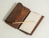 Ernest Robson. Somerset 1895-1923. &lsquo;Surrey v Somerset. The Oval 1900&rsquo;. Brown leather wallet with compartments for cash, coinage, documents, paper book for notes with bone? pen etc. Inscribed to the closing flap of the wallet Somerset v Surrey at The Oval - 3
