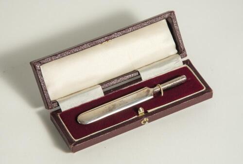 Silver cricket bat. Miniature silver cricket bat, hallmarked London 1930, presented in oblong box. The bat measures 4&rdquo; long. An attractive item