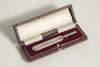 Silver cricket bat. Miniature silver cricket bat, hallmarked London 1930, presented in oblong box. The bat measures 4&rdquo; long. An attractive item