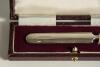 Silver cricket bat. Miniature silver cricket bat, hallmarked London 1930, presented in oblong box. The bat measures 4&rdquo; long. An attractive item - 2