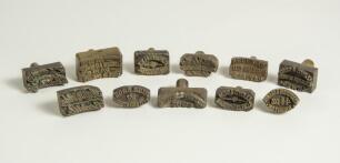 Cricket ball dyes/stamps. Interesting and unusual collection of eleven cricket ball brass metal dye stamps for stamping makers details onto cricket balls, normally in gold. The makers names include &lsquo;Dark & Sons, Lord&rsquo;s Ground, London&rsquo;, &lsquo;E.H. Bowley of Win