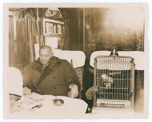 Kumar Shri Ranjitsinhji. Cambridge University, Sussex, London County & England 1893-1920. Original sepia press photograph of Ranji in later years, seated on a train at Victoria before leaving England for India on 24th December 1932 for the final time. Ran
