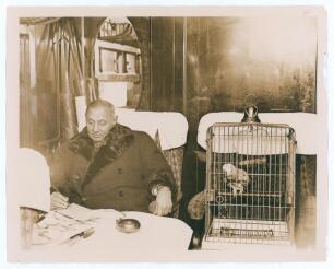 Kumar Shri Ranjitsinhji. Cambridge University, Sussex, London County & England 1893-1920. Original sepia press photograph of Ranji in later years, seated on a train at Victoria before leaving England for India on 24th December 1932 for the final time. Ran