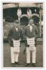 Sussex C.C.C. &lsquo;Cox&rsquo;s Benefit&rsquo; 1920. Rarer sepia real photograph postcard of Sussex players George Street and Henry Roberts standing full length wearing cricket attire and blazers, Street with Sussex cap. The photograph taken at the Hove cricket ground, th