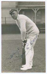 Thomas Edwin Reed &lsquo;Tommy&rsquo; Cook. Sussex 1922-1937. Sepia real photograph plain back postcard of Cook standing full length in batting pose wearing Sussex cap. Signed in ink to the photograph by Cook. Official stamp to verso for Albert Wilkes & Son, West Bro