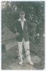 Edward Henry &lsquo;Ted&rsquo; Bowley. Sussex, Auckland & England 1912-1934. Mono real photograph postcard of Bowley standing full length under a tree wearing blazer and Sussex cap. Very nicely signed in black ink to the photograph by Bowley. Nias of Brighton. Postal