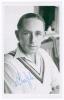 Stewart Cathie &lsquo;Billy&rsquo; Griffith. Cambridge University, Surrey, Sussex & England 1934-1954. Mono real photograph plain back postcard of Griffith head and shoulders wearing cricket attire and M.C.C. tour blazer. Signed in blue biro to the photograph by Grif