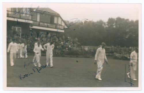 Sussex 1952. Mono real photograph plain back candid style postcard of the Sussex team entering the field of play from the pavilion with spectators looking on, for the match v Lancashire at Blackpool, 6th- 8th August 1952. The photograph signed in ink and 