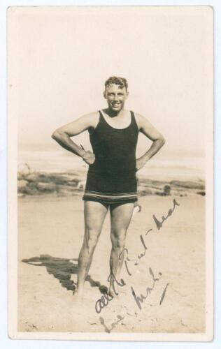 Maurice William Tate. Sussex & England 1912-1937. Original candid style sepia photograph of Tate standing full length on the beach in swimming attire. Signed in ink to the front with dedication by Tate, with further annotation in ink to verso &lsquo;All of us h