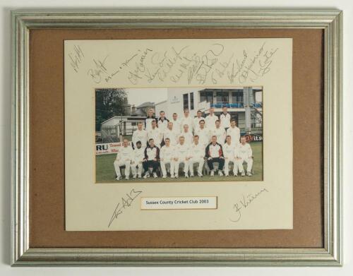 &lsquo;Sussex County Cricket Club 2003&rsquo;. Official colour photograph of the County Championship winning team seated and standing in rows wearing cricket attire. The photograph measures approx. 9&rdquo;x5.5&rdquo;, set in mount. Signed in pencil to the mount borders by fifte