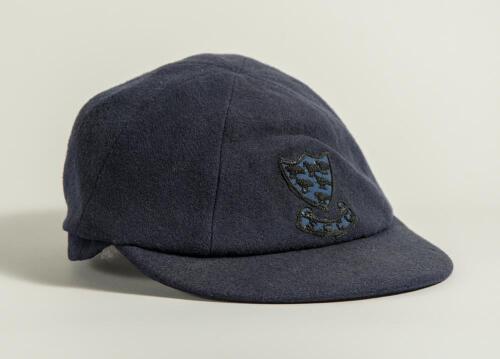 Reverend David Stuart Sheppard. Cambridge University, Sussex & England 1950-1964. Sussex navy blue 1st XI cloth cricket cap worn by Sheppard during his playing career. The cap, by W.V. Brown of Eton, embroidered with the six martlet&rsquo;s emblem of Sussex to 