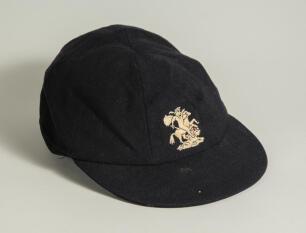 Edward Ralph Dexter. Sussex & England 1957-1968. M.C.C./England navy blue touring cap, by Simpson of Piccadilly, worn by Dexter during his Test playing career touring with England. The cap, with embroidered England emblem of St. George and the Dragon, to 