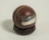 George Benjamin Street, Sussex & England 1909-1923. Cricket ball presented to George Street in 1916. The ball has two silver plaques attached to it with the following inscriptions, &lsquo;Sergeant Street. 2/6th Sussex Regiment. From Captain Plumer. Bangalore 19 - 2