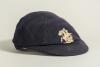 George Benjamin Street, Sussex & England 1909-1923. M.C.C. navy blue touring cap with embroidered emblem of St. George and the dragon, by E.C. Devereux of Eton, worn by Street on the M.C.C. tour of South Africa in 1922/23. &lsquo;G. Street&rsquo; handwritten in bla