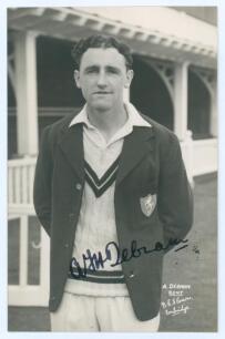 Alexander Frederick Henry Debnam. Kent & Hampshire 1948-1951. Mono real photograph plain back postcard of Debnam three quarter length in cricket attire and Kent blazer. Boldly signed in black ink to the photograph by Debnam. Printed title &lsquo;A. Debnam, Kent