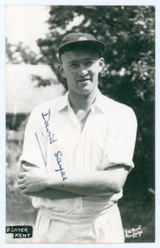 David Michael Sayer. Kent 1955-1976. Mono real photograph postcard of Sayer half length wearing cricket attire and M.C.C. cap. Nicely signed in ink to the photograph by Sayer. Printed title &lsquo;D. Sayer, Kent&rsquo; to lower left corner. J.D. Hunt of Tonbridge. Ve