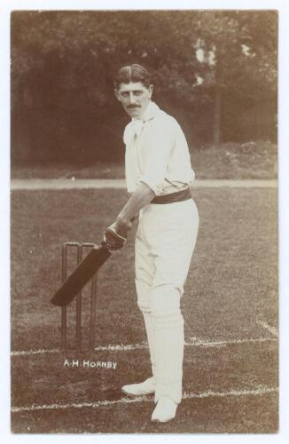 Albert Henry Hornby. Cambridge University & Lancashire 1898-1914. Early original sepia real photograph postcard of Hornby standing full length at the wicket in batting pose. Printed title &lsquo;A.H. Hornby&rsquo;. Blind embossed stamp for Foster of Brighton to lower